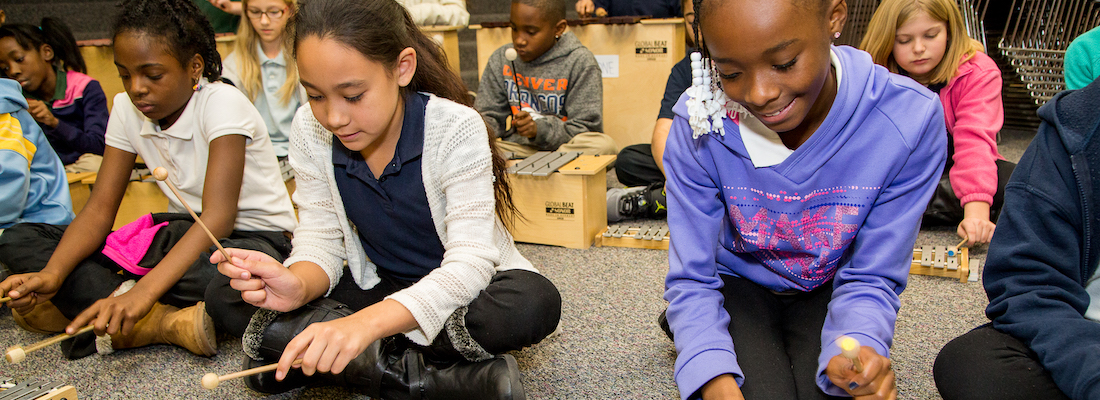 Students playing musical instruments